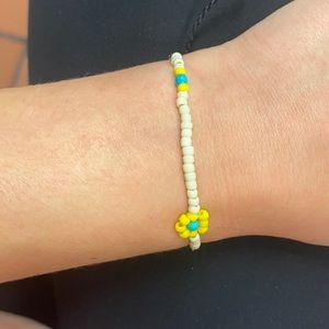 black, white, yellow, blue pura vida bracelet